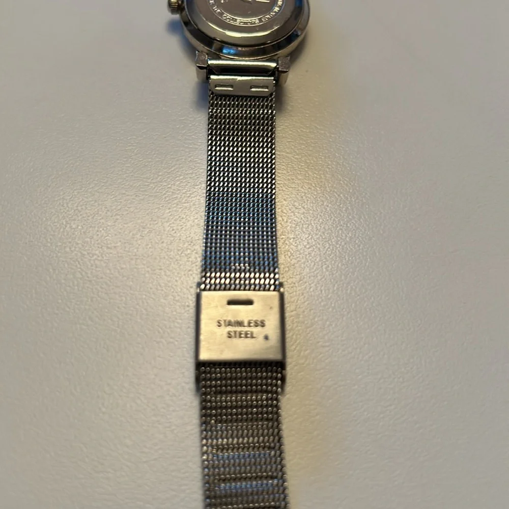 Two vintage quartz watches one stainless steel with hearts one with blue trim